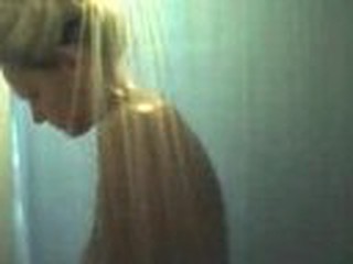 Mature blond milf with large boobs filmed on hidden cam taking a shower.