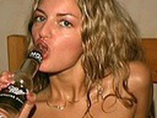 Cracking blonde is drinking beer with the horny voyeur closely watching her every move and gulp. When she's done with the drink she drives the guy crazy stuffing the empty bottle deep into her soggy beaver!